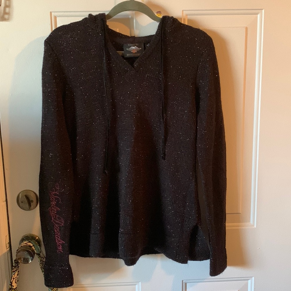 Slightly used size medium Harley Davidson hooded sweater with silver sparkles